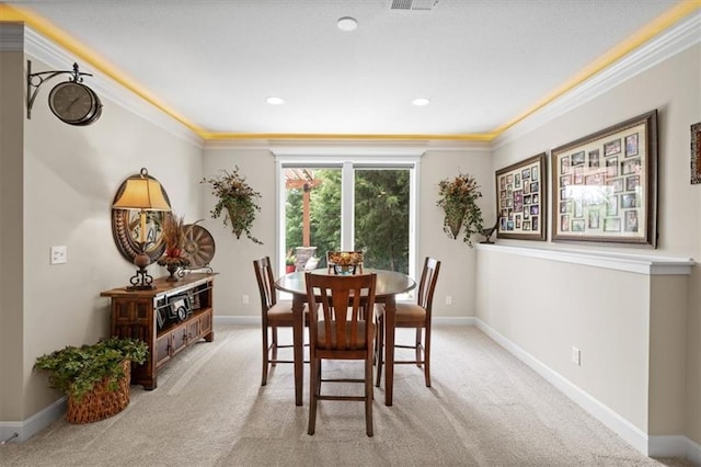 carpeted dining area with ornamental molding, baseboards, and recessed lighting