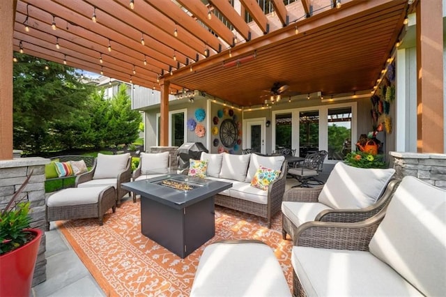 view of patio featuring an outdoor living space with a fire pit, a ceiling fan, and french doors