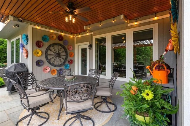 view of patio / terrace with outdoor dining space, area for grilling, and a ceiling fan