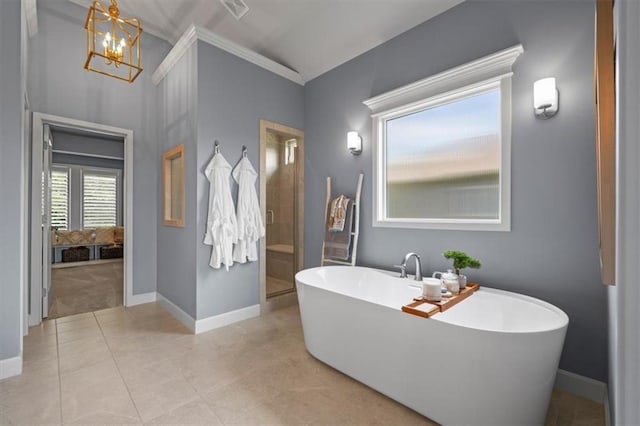 bathroom featuring a shower stall, a chandelier, baseboards, and ornamental molding