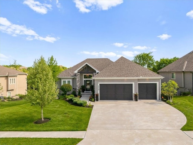 25749 W 96th Ter, Lenexa, KS 66227 - view of front of home featuring a garage, a front lawn, concrete driveway, and stucco siding