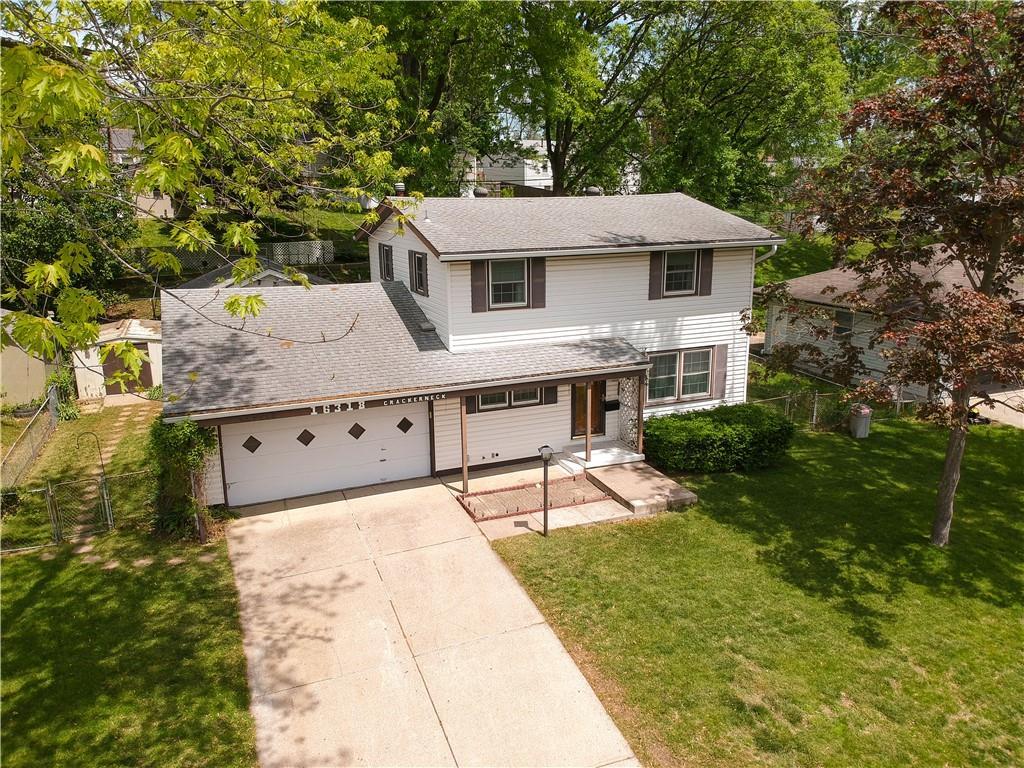16318 E Crackerneck Rd, Independence, MO 64055 - traditional-style home with driveway, roof with shingles, and a garage