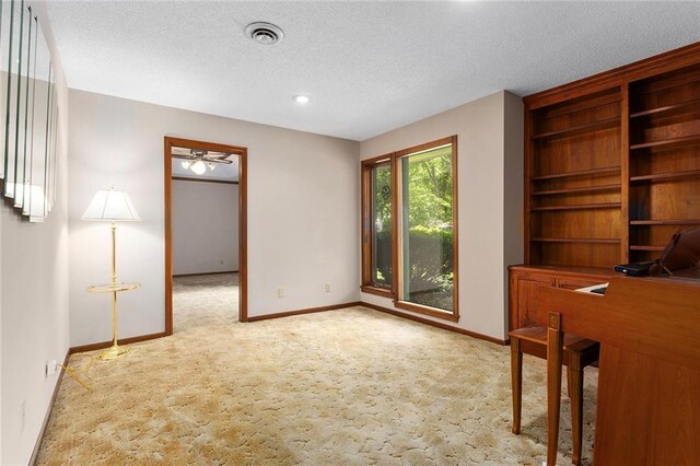 7613 NW Valley Rd, Kansas City, MO 64152 - unfurnished office featuring carpet, baseboards, a textured ceiling, and a ceiling fan