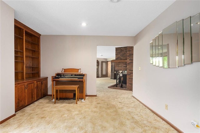 7613 NW Valley Rd, Kansas City, MO 64152 - sitting room featuring carpet flooring, baseboards, and built in features