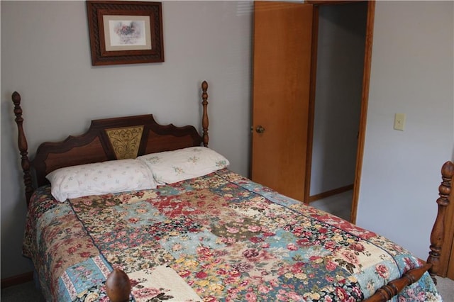 carpeted bedroom featuring baseboards