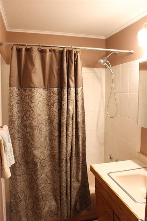 full bath with shower / tub combo with curtain, vanity, and ornamental molding