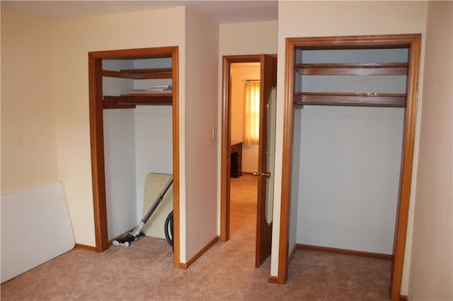 unfurnished bedroom with light colored carpet