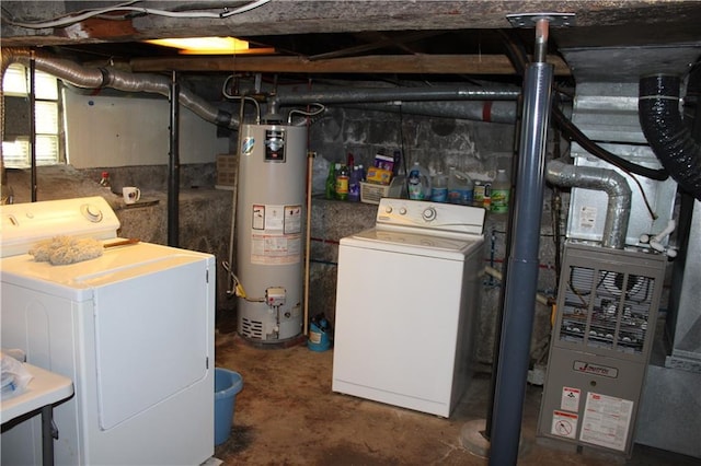 basement featuring water heater and separate washer and dryer