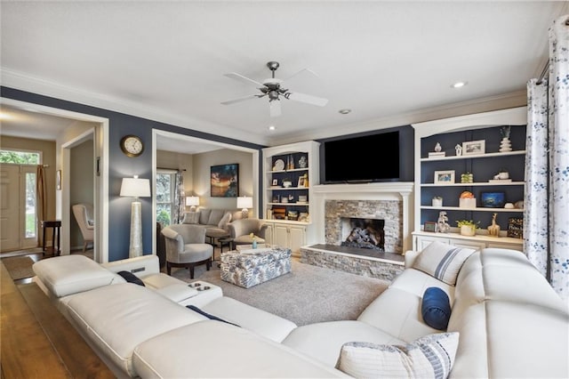 14910 Rhodes Cir, Lenexa, KS 66215 - living room featuring a ceiling fan, a fireplace, ornamental molding, and recessed lighting