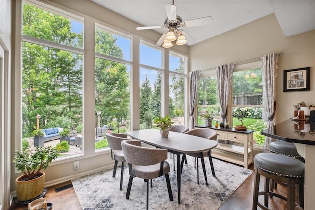 14910 Rhodes Cir, Lenexa, KS 66215 - sunroom / solarium featuring wood finished floors and baseboards
