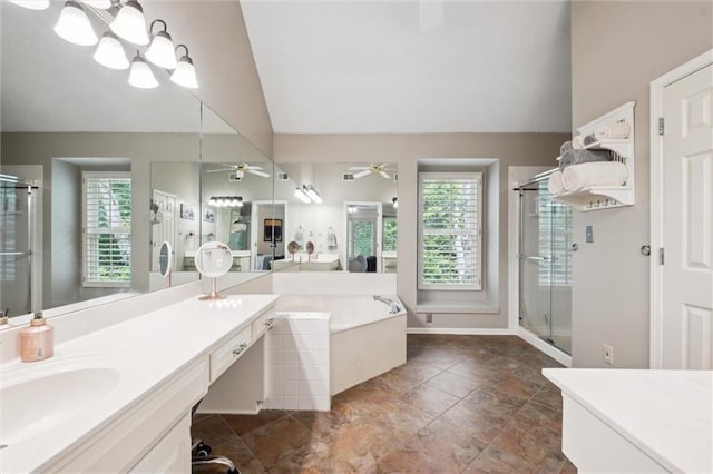 14910 Rhodes Cir, Lenexa, KS 66215 - bathroom with vaulted ceiling, a ceiling fan, healthy amount of natural light, a stall shower, and vanity