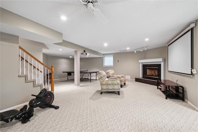 14910 Rhodes Cir, Lenexa, KS 66215 - interior space featuring a fireplace with raised hearth, ceiling fan, recessed lighting, and stairs