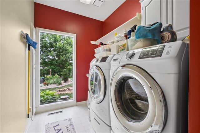 14910 Rhodes Cir, Lenexa, KS 66215 - washroom featuring washing machine and clothes dryer