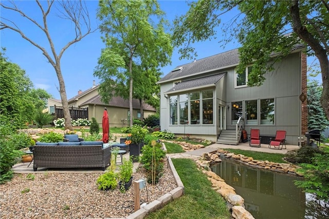 14910 Rhodes Cir, Lenexa, KS 66215 - rear view of property with a patio and an outdoor hangout area