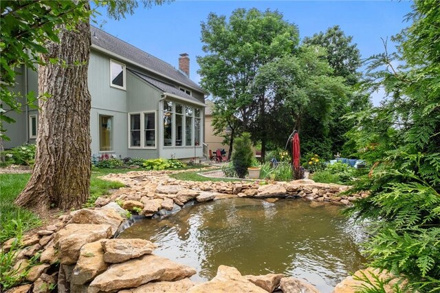 14910 Rhodes Cir, Lenexa, KS 66215 - view of yard featuring a small pond
