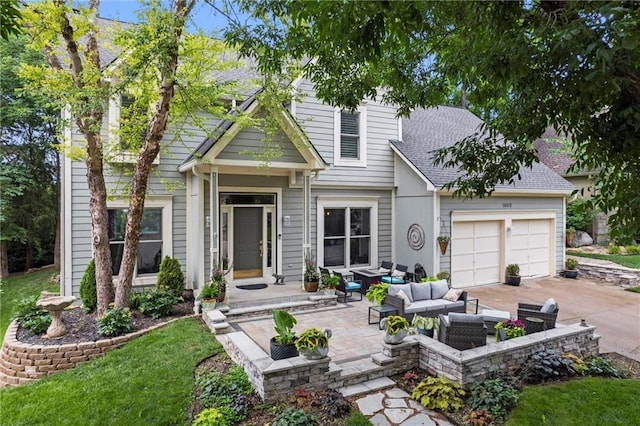 14910 Rhodes Cir, Lenexa, KS 66215 - view of front of home featuring an outdoor hangout area, a garage, driveway, and a shingled roof