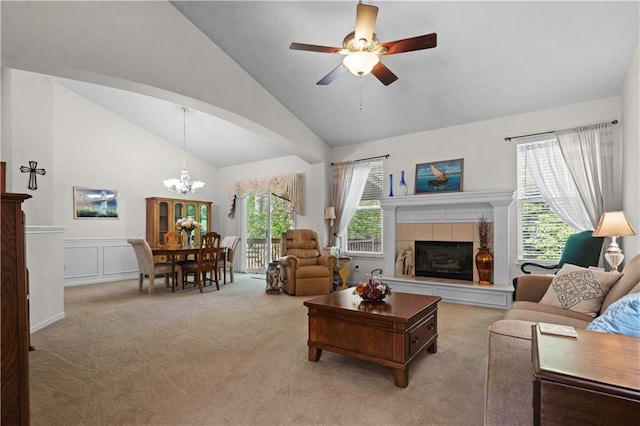 15619 S Blackfoot St, Olathe, KS 66062 - living room with light carpet, a ceiling fan, a chandelier, a tile fireplace, and a decorative wall
