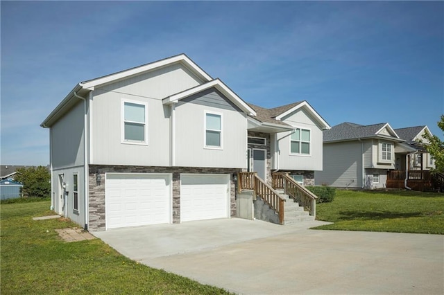 605 Carr St, Knob Noster, MO 65336 - bi-level home featuring an attached garage, stone siding, concrete driveway, and a front lawn