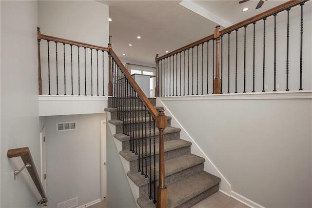 605 Carr St, Knob Noster, MO 65336 - stairway with recessed lighting, baseboards, ceiling fan, and a high ceiling
