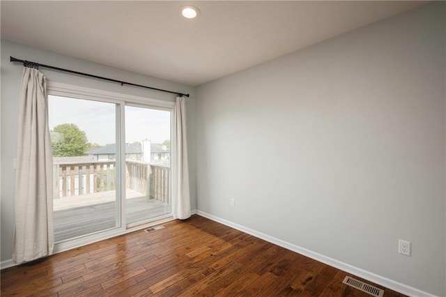 605 Carr St, Knob Noster, MO 65336 - empty room featuring baseboards, dark wood-style floors, and recessed lighting