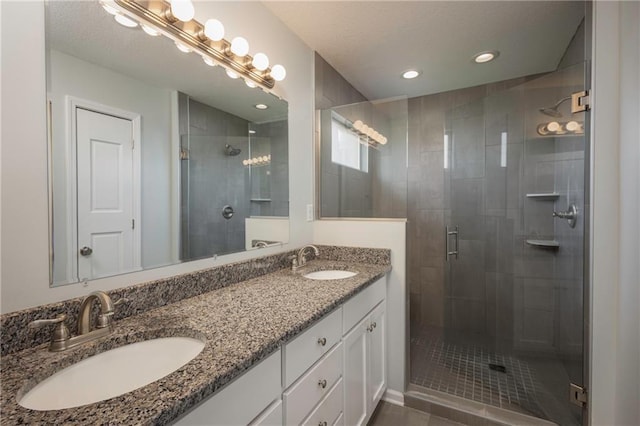 605 Carr St, Knob Noster, MO 65336 - full bath featuring a shower stall, double vanity, and recessed lighting