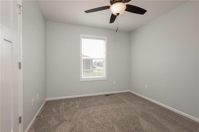 605 Carr St, Knob Noster, MO 65336 - carpeted empty room with baseboards and a ceiling fan