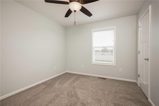605 Carr St, Knob Noster, MO 65336 - carpeted spare room featuring baseboards and a ceiling fan