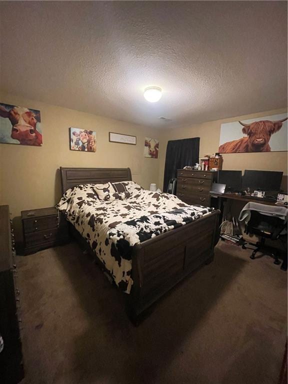 carpeted bedroom featuring a textured ceiling