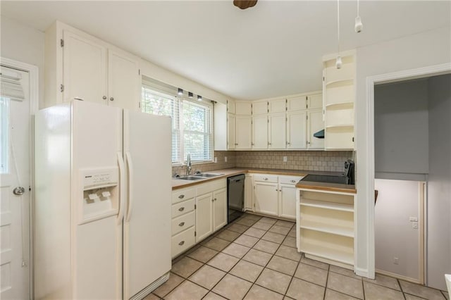 5707 W 101st Ter, Overland Park, KS 66207 - kitchen with open shelves, white fridge with ice dispenser, a sink, light tile patterned floors, and decorative backsplash