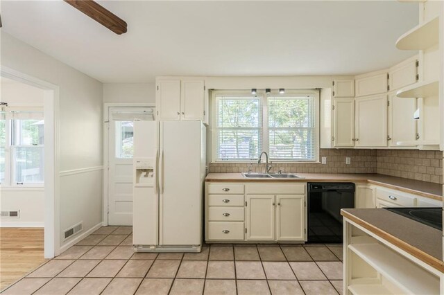 5707 W 101st Ter, Overland Park, KS 66207 - kitchen with black appliances, a sink, plenty of natural light, and backsplash