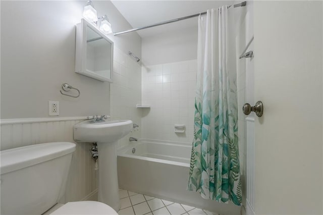 5707 W 101st Ter, Overland Park, KS 66207 - bathroom with shower / bath combo with shower curtain, toilet, and tile patterned floors