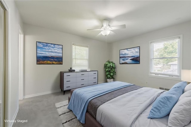 5707 W 101st Ter, Overland Park, KS 66207 - bedroom featuring light colored carpet, baseboards, and a ceiling fan