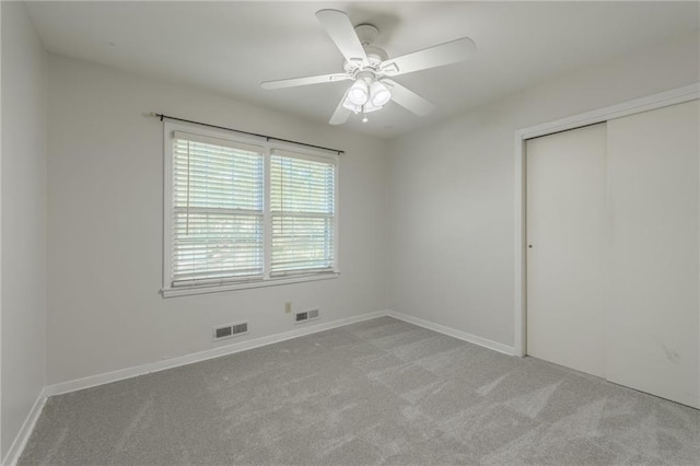 5707 W 101st Ter, Overland Park, KS 66207 - unfurnished bedroom featuring carpet floors, a closet, baseboards, and a ceiling fan