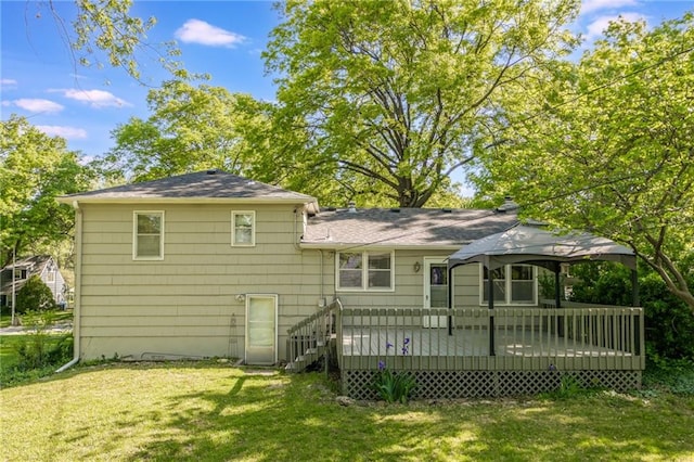 5707 W 101st Ter, Overland Park, KS 66207 - rear view of house featuring a gazebo, a yard, a wooden deck, and a shingled roof
