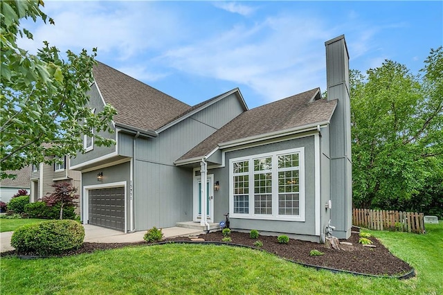 15951 S Avalon St, Olathe, KS 66062 - view of front of property featuring a shingled roof, a garage, concrete driveway, and a chimney