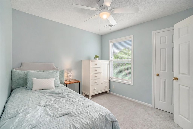 15951 S Avalon St, Olathe, KS 66062 - bedroom featuring light colored carpet, baseboards, a textured ceiling, and ceiling fan
