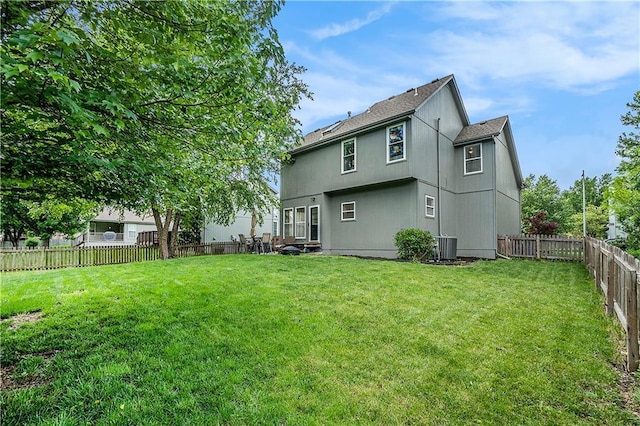 15951 S Avalon St, Olathe, KS 66062 - rear view of house featuring roof with shingles and central AC