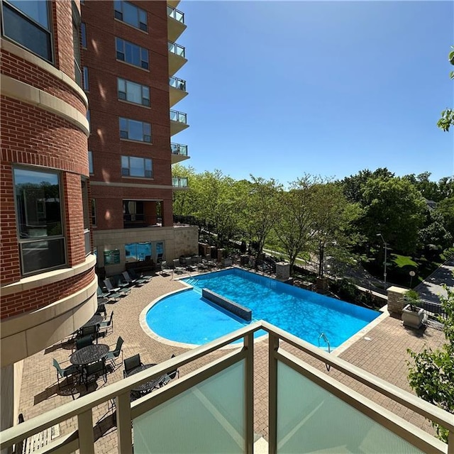 4950 Central St Unit 102, Kansas City, MO 64112 - community pool featuring a patio area