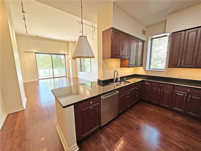 4950 Central St Unit 102, Kansas City, MO 64112 - kitchen with dishwasher, a sink, dark wood-style floors, and open floor plan