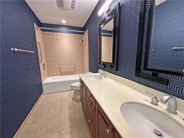 4950 Central St Unit 102, Kansas City, MO 64112 - full bath with tile patterned floors, toilet, bathtub / shower combination, and double vanity