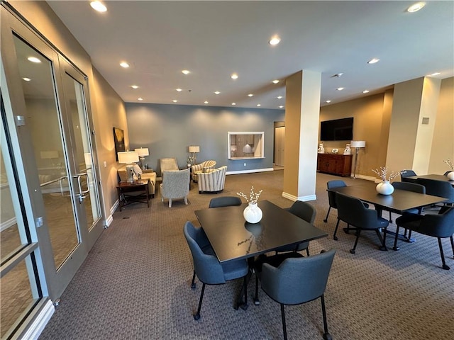 4950 Central St Unit 102, Kansas City, MO 64112 - carpeted dining area featuring recessed lighting, baseboards, and french doors