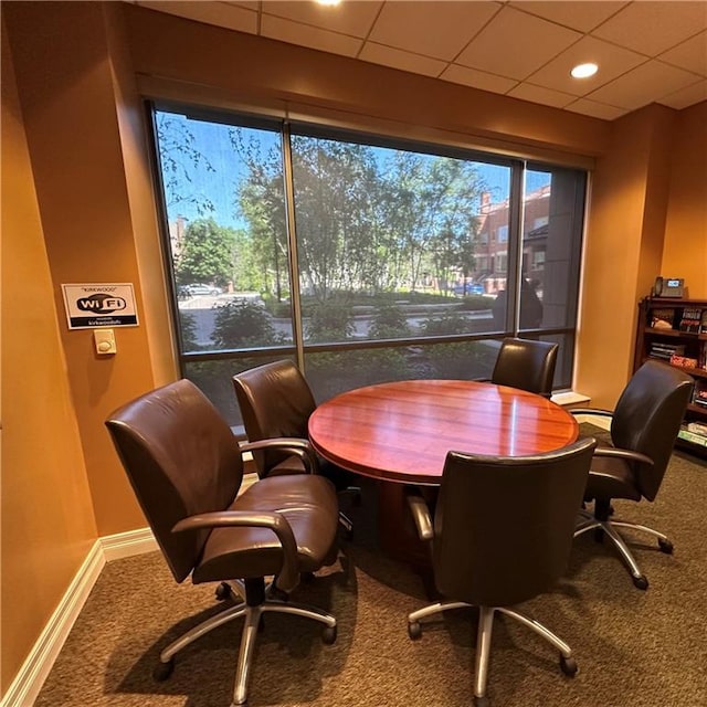 4950 Central St Unit 102, Kansas City, MO 64112 - office area with carpet, baseboards, and a paneled ceiling