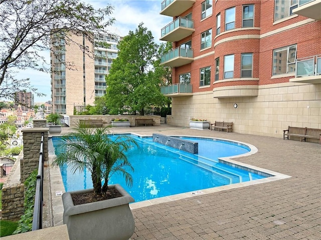 4950 Central St Unit 102, Kansas City, MO 64112 - community pool with a patio area