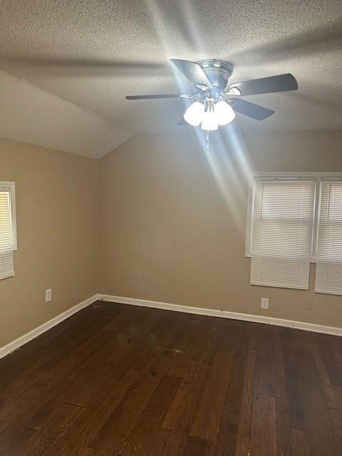 3805 Laurel Ave, Kansas City, MO 64133 - empty room with ceiling fan, a textured ceiling, and wood finished floors