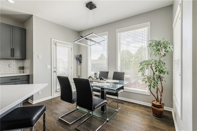 dining room with plenty of natural light and baseboards