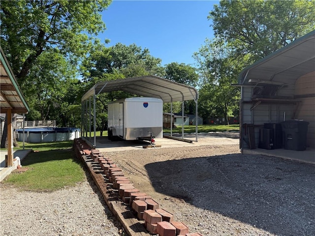 112 N Burns St N, Independence, KS 67301 - view of yard featuring a carport and a covered pool