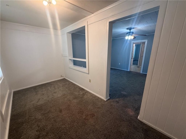 112 N Burns St N, Independence, KS 67301 - unfurnished room with dark colored carpet and a ceiling fan