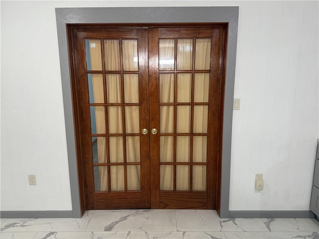 112 N Burns St N, Independence, KS 67301 - doorway featuring baseboards, light marble finish flooring, and french doors