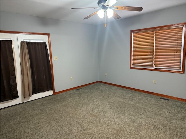 112 N Burns St N, Independence, KS 67301 - carpeted spare room with a ceiling fan and baseboards