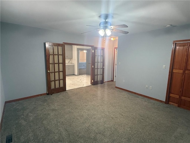 112 N Burns St N, Independence, KS 67301 - spare room with french doors, baseboards, and a ceiling fan
